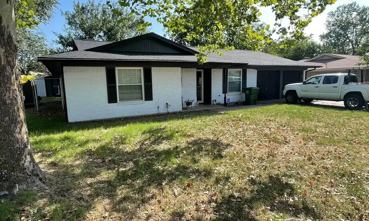 Professional roofing crew working on a residential roof in Shady Hollow